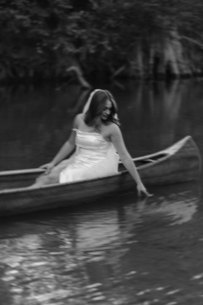 texas hill country elopement bride in a wedding canoe.