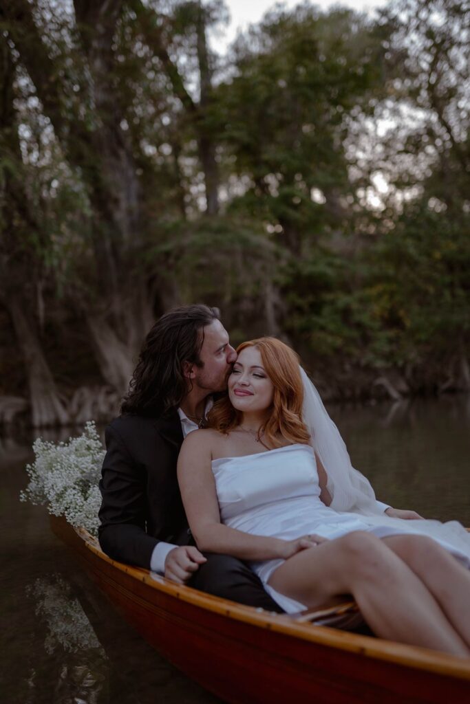 eloping couple in their Texas hill country elopement canoe.